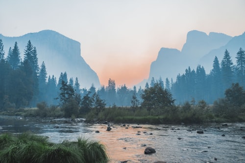 A wide valley river at first light